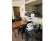 Cozy kitchen with breakfast bar, stone accent wall, and adjacent dining area at 8101 W Flamingo Rd # 2078, Las Vegas, NV 89147