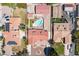 Directly above, a home displays its pool and tidy surroundings, nested among similar properties in a planned community at 8340 W Fisher Ave, Las Vegas, NV 89149