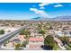 Elevated view featuring an established neighborhood with mature trees and home's well-maintained lot at 8340 W Fisher Ave, Las Vegas, NV 89149