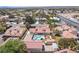 Expansive aerial view of a single-story home with a pool and well-maintained landscaping in a suburban neighborhood at 8340 W Fisher Ave, Las Vegas, NV 89149