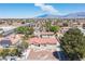 Aerial view showcasing the neighborhood, mature trees, and the home's well-maintained front yard at 8340 W Fisher Ave, Las Vegas, NV 89149
