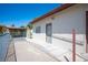Backyard with access ramp, covered patio area and mature landscaping at 8340 W Fisher Ave, Las Vegas, NV 89149
