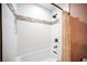 Bathroom with shower featuring white tile and decorative accents at 8340 W Fisher Ave, Las Vegas, NV 89149