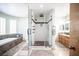 Beautiful bathroom featuring a glass-enclosed shower and a separate soaking tub at 8340 W Fisher Ave, Las Vegas, NV 89149