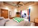 Bedroom featuring a cozy bed, a view into the living room, and ample natural light at 8340 W Fisher Ave, Las Vegas, NV 89149