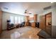 Bonus room with built in cabinets and shelving, shuttered windows and a desk at 8340 W Fisher Ave, Las Vegas, NV 89149