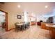 Open-concept dining area flows seamlessly into the kitchen and living space, perfect for entertaining at 8340 W Fisher Ave, Las Vegas, NV 89149