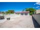 Detached garage with two bays, desert landscaping, block wall and backyard at 8340 W Fisher Ave, Las Vegas, NV 89149