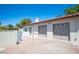 Detached garage with two bays, desert landscaping and access gate at 8340 W Fisher Ave, Las Vegas, NV 89149