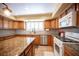 Updated kitchen featuring stainless steel appliances, granite countertops, and mosaic backsplash at 8340 W Fisher Ave, Las Vegas, NV 89149
