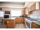 Well-equipped kitchen with ample counter space, white appliances, and a cozy breakfast area at 8340 W Fisher Ave, Las Vegas, NV 89149