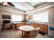 Traditional kitchen with wooden cabinets, stainless steel appliances, and a breakfast nook at 8340 W Fisher Ave, Las Vegas, NV 89149