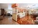 Living area with hardwood floors, a fireplace, and open access to the kitchen at 8340 W Fisher Ave, Las Vegas, NV 89149