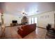 The living room features a breakfast bar, television, wood burning stove, and ceiling fan at 8340 W Fisher Ave, Las Vegas, NV 89149