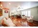 Bright living room featuring hardwood floors, comfortable seating, and an open layout at 8340 W Fisher Ave, Las Vegas, NV 89149