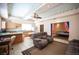 Open-concept living room with tiled floors, ceiling fan, seating area, and connected to the kitchen at 8340 W Fisher Ave, Las Vegas, NV 89149