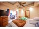 Bedroom featuring a bed with patterned blankets, wood furniture, and tiled floors at 8340 W Fisher Ave, Las Vegas, NV 89149