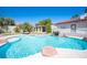 Backyard pool with rock features and lush landscaping creating a private and inviting oasis at 8340 W Fisher Ave, Las Vegas, NV 89149