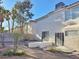 Exterior view of the backyard and rear of the home with patio and desert landscaping at 8717 Harvest Valley Ave, Las Vegas, NV 89129