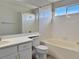 A clean bathroom featuring a combined tub and shower, tile surround, and modern fixtures at 8717 Harvest Valley Ave, Las Vegas, NV 89129