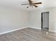 Bedroom with wood laminate flooring, a ceiling fan, and white walls at 8717 Harvest Valley Ave, Las Vegas, NV 89129