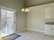 A dining area that opens up to the backyard through a sliding glass door at 8717 Harvest Valley Ave, Las Vegas, NV 89129