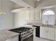 Beautiful kitchen with granite countertops, stainless steel appliances and a sink under a window at 8717 Harvest Valley Ave, Las Vegas, NV 89129