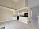 Spacious kitchen with white cabinets, granite countertops, and black appliances at 8717 Harvest Valley Ave, Las Vegas, NV 89129