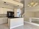 Open floor plan featuring kitchen island with granite countertops and white cabinetry at 8717 Harvest Valley Ave, Las Vegas, NV 89129