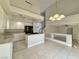 An open floor plan kitchen boasting granite countertops, an island and stainless appliances at 8717 Harvest Valley Ave, Las Vegas, NV 89129