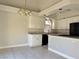 Bright kitchen with white cabinets, granite countertops, and stainless steel appliances at 8717 Harvest Valley Ave, Las Vegas, NV 89129