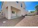 Large backyard featuring a covered patio area with minimal landscaping and fencing at 9004 Snowtrack Ave, Las Vegas, NV 89149