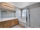 Bathroom featuring a soaking tub, shower, and a double sink vanity at 9004 Snowtrack Ave, Las Vegas, NV 89149