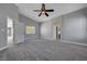 Bedroom with a doorway, a ceiling fan, and natural light from the window at 9004 Snowtrack Ave, Las Vegas, NV 89149