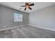 Bedroom with carpeting, a ceiling fan, and abundant natural light from the window at 9004 Snowtrack Ave, Las Vegas, NV 89149
