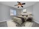 Bedroom featuring a ceiling fan, a window, and a queen size bed with modern decor at 9004 Snowtrack Ave, Las Vegas, NV 89149