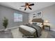 Staged bedroom with neutral tones, soft lighting, and a cozy bed at 9004 Snowtrack Ave, Las Vegas, NV 89149