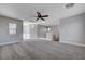 Upstairs bonus room featuring carpeting, a ceiling fan, and abundant natural light at 9004 Snowtrack Ave, Las Vegas, NV 89149