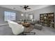 Comfortable living room features neutral tones, plush seating, and a stylish bookshelf at 9004 Snowtrack Ave, Las Vegas, NV 89149