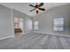 Main bedroom with carpeting, a ceiling fan, and abundant natural light from the window at 9004 Snowtrack Ave, Las Vegas, NV 89149