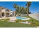 Backyard with pool, mature trees, and manicured landscaping at 9208 November Breeze St, Las Vegas, NV 89123