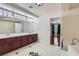 This primary bathroom features double sinks, a tub, and a shower at 9208 November Breeze St, Las Vegas, NV 89123