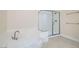 This bathroom has a garden tub and a glass enclosed shower at 9208 November Breeze St, Las Vegas, NV 89123