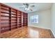 Bedroom with hardwood floors and a custom built-in bookcase at 9208 November Breeze St, Las Vegas, NV 89123