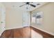 This bedroom boasts hardwood floors and a ceiling fan at 9208 November Breeze St, Las Vegas, NV 89123