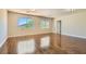 Spacious bonus room featuring hardwood floors, two bright windows, and natural light at 9208 November Breeze St, Las Vegas, NV 89123