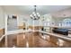 Spacious living room showcasing hardwood floors, elegant lighting, staircase, and open floor plan at 9208 November Breeze St, Las Vegas, NV 89123