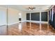 This spacious living room includes wood floors and large windows at 9208 November Breeze St, Las Vegas, NV 89123