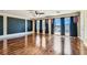 This living room has wood floors, big windows and access to balcony at 9208 November Breeze St, Las Vegas, NV 89123