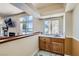 Wet bar with wood cabinets and granite counters at 9208 November Breeze St, Las Vegas, NV 89123